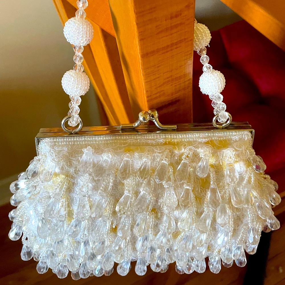Small hand beaded bag to dress up any outfit or dress. Brand new and lovely